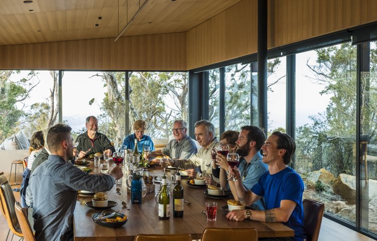 Guests eating and drinking at Three Capes Lodge
