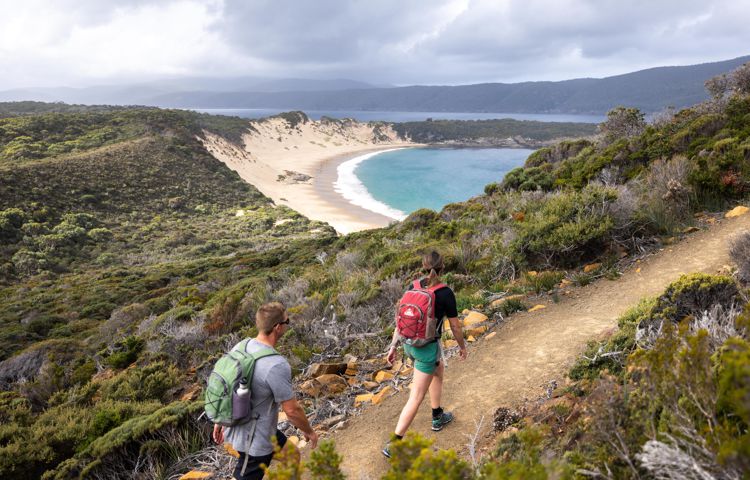 Guests walking along path at Three Capes
