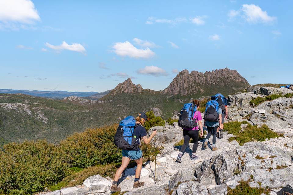 Walkers hiking through Cradle Mountain