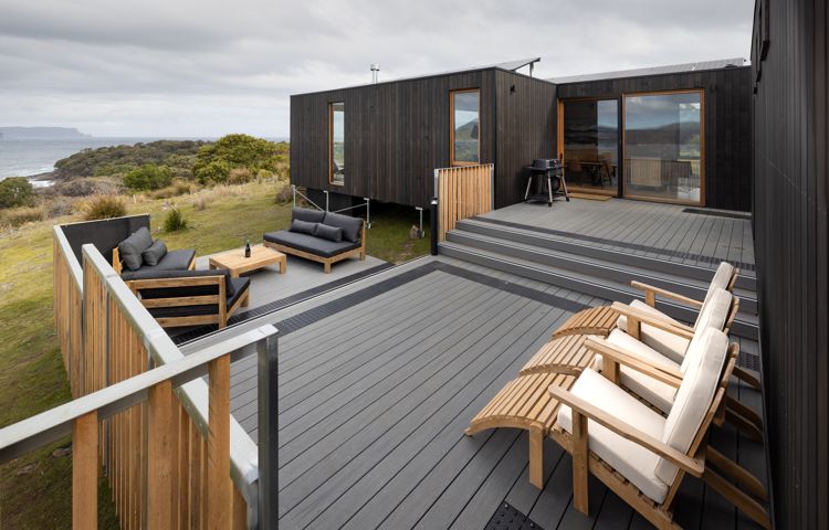 Relax on our spacious deck at our luxury camp on the Three Capes Track