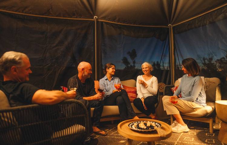 Guests relaxing in main tent on Larapinta Trail Walk