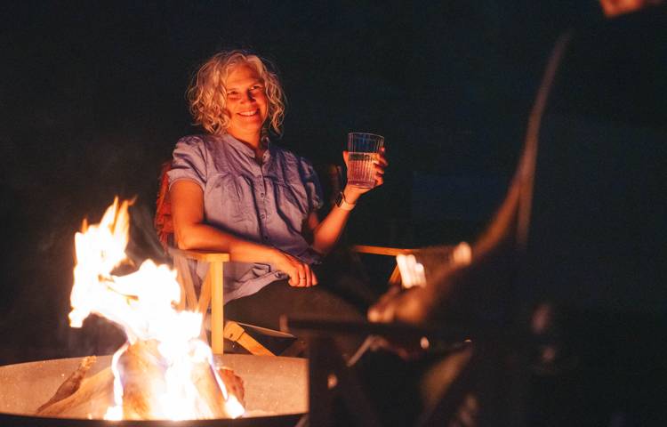 Guest sitting near fire relaxing