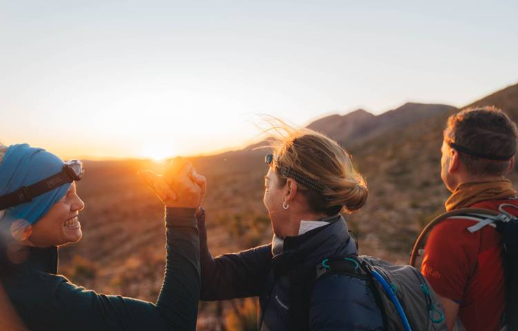 walkers watching sunrise at Larapinta Trail Walk
