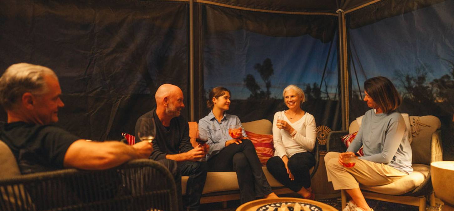 Guests in luxury Larapinta tent at night