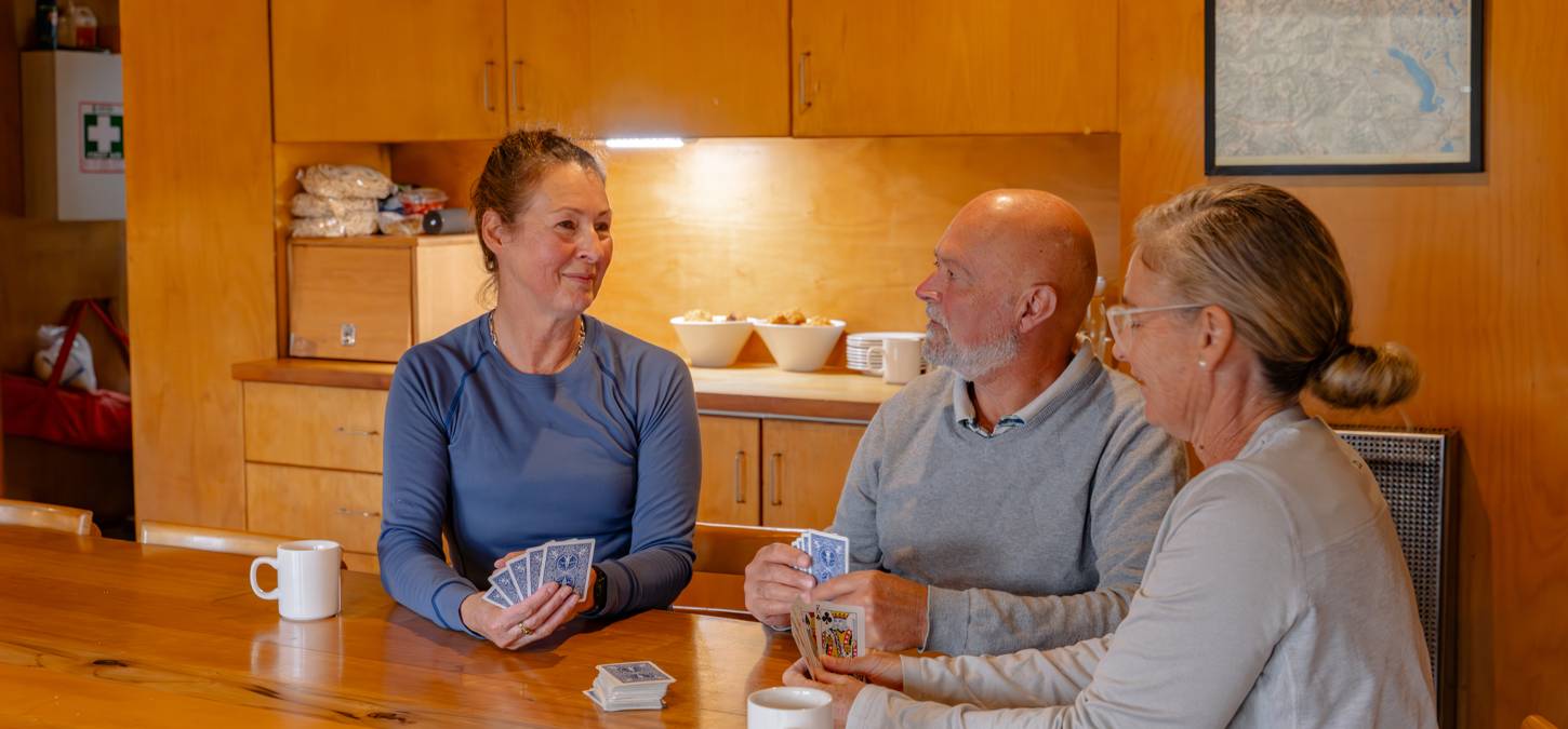 Guests sitting at table in Cradle mountain huts accommodation