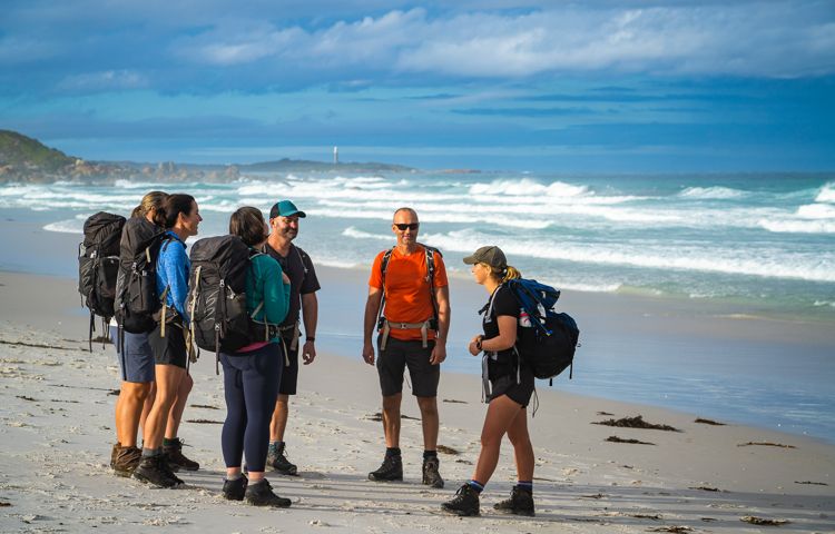 Guests talking to each other on Bay of Fires Beach
